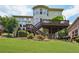 Spacious backyard with a wooden deck, stairs and lush green lawn, great for outdoor activities at 5511 Highland Preserve Dr, Mableton, GA 30126