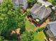 Enjoy a relaxing backyard featuring a wooden deck, lush greenery, and mature trees for privacy and shade at 5511 Highland Preserve Dr, Mableton, GA 30126