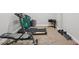 Home gym featuring a treadmill and weight set on carpeted flooring at 5511 Highland Preserve Dr, Mableton, GA 30126