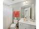 Bright bathroom with a white vanity, framed mirror, and a shower-tub combo at 5511 Highland Preserve Dr, Mableton, GA 30126