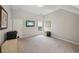 Well-lit room with neutral carpet, a TV, and modern art at 5511 Highland Preserve Dr, Mableton, GA 30126