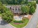 Aerial shot of the clubhouse featuring brick facade, manicured landscaping, and accessible parking at 5511 Highland Preserve Dr, Mableton, GA 30126