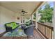 Inviting covered patio with wicker furniture, ceiling fan, and outdoor access at 5511 Highland Preserve Dr, Mableton, GA 30126