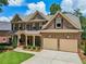 Beautiful brick home with a two-car garage, manicured lawn, and landscaped front yard at 5511 Highland Preserve Dr, Mableton, GA 30126