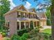 Beautiful brick home with a welcoming front porch and well-maintained landscaping at 5511 Highland Preserve Dr, Mableton, GA 30126