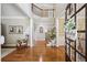 Grand foyer with hardwood floors, staircase and a view of the entryway at 5511 Highland Preserve Dr, Mableton, GA 30126