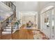 Spacious foyer with hardwood floors, staircase, and view into the dining room at 5511 Highland Preserve Dr, Mableton, GA 30126