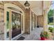 Inviting front door with brick facade, decorative wreath and side-light windows at 5511 Highland Preserve Dr, Mableton, GA 30126