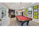 Spacious game room features a pool table, wet bar, and access to a staircase at 5511 Highland Preserve Dr, Mableton, GA 30126