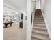 Spacious game room with a pool table and seating area for entertaining guests, features access to a staircase at 5511 Highland Preserve Dr, Mableton, GA 30126