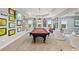Open concept game room with a large pool table and wall decor, plenty of space to relax at 5511 Highland Preserve Dr, Mableton, GA 30126