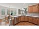 Well-lit kitchen featuring hardwood floors, stainless steel appliances, and a cozy breakfast nook at 5511 Highland Preserve Dr, Mableton, GA 30126