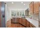 Charming kitchen featuring hardwood floors, stainless steel appliances, and ample counter space at 5511 Highland Preserve Dr, Mableton, GA 30126
