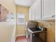 Functional laundry room with a modern washer and dryer, and ample storage space at 5511 Highland Preserve Dr, Mableton, GA 30126