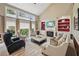 Inviting living room with tall windows, a fireplace, and a cozy seating arrangement at 5511 Highland Preserve Dr, Mableton, GA 30126