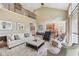 Bright and airy living room with a fireplace and a loft overlooking the space at 5511 Highland Preserve Dr, Mableton, GA 30126