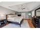 This spacious main bedroom is well lit and features hardwood floors and a large window for plenty of natural light at 5511 Highland Preserve Dr, Mableton, GA 30126