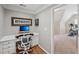 Bright office featuring wood floors and an adjacent exercise space at 5511 Highland Preserve Dr, Mableton, GA 30126