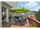 Outdoor patio with dining set and umbrella perfect for entertaining guests at 5511 Highland Preserve Dr, Mableton, GA 30126