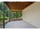 Covered patio area provides ample outdoor living space with wooden beams and concrete flooring at 5511 Highland Preserve Dr, Mableton, GA 30126
