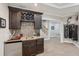 A well-stocked wet bar in the game room features ample storage for drinks and glassware at 5511 Highland Preserve Dr, Mableton, GA 30126