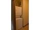 Laundry closet with stacked washer and dryer units, offering convenience and space-saving design at 898 Oak St Sw # 1311, Atlanta, GA 30310