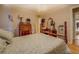 Bedroom features a large bed, dressers, bedside tables, hardwood floors, and light-colored walls at 1349 Springwood Nw Dr, Conyers, GA 30012