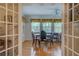 Bright breakfast nook with hardwood floors, plenty of windows and dark wooden table at 1349 Springwood Nw Dr, Conyers, GA 30012