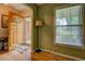 Bright foyer with hardwood floors, a striking front door, and a view to the front yard at 1349 Springwood Nw Dr, Conyers, GA 30012