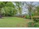 Inviting one-story brick home with green lawn and mature trees in a quiet neighborhood at 1349 Springwood Nw Dr, Conyers, GA 30012