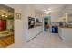 Functional kitchen featuring white cabinets, white tiled floors, and plenty of counter space at 1349 Springwood Nw Dr, Conyers, GA 30012