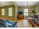 Inviting living room with hardwood floors, large windows, and comfortable seating at 1349 Springwood Nw Dr, Conyers, GA 30012