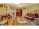 Traditional living room with hardwood floors, vintage furniture, and an open layout to other areas at 1349 Springwood Nw Dr, Conyers, GA 30012