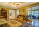 Spacious living room with a decorative rug, hardwood floors, vintage furniture, and views to other rooms at 1349 Springwood Nw Dr, Conyers, GA 30012