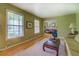 Well-lit living room with hardwood floors, classic decor, and a view to other rooms at 1349 Springwood Nw Dr, Conyers, GA 30012