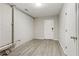 Unfinished basement with laminate flooring provides opportunity for storage or future renovation at 208 Hembree Park Ter, Roswell, GA 30076