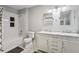 Bathroom features dual sinks, marble countertops, and subway tiled shower-tub combo at 208 Hembree Park Ter, Roswell, GA 30076