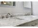 Close up of bathroom double vanity, showing marble countertop and modern chrome faucets at 208 Hembree Park Ter, Roswell, GA 30076