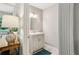 Elegant half bath with decorative mirror, modern vanity, and stylish lighting at 208 Hembree Park Ter, Roswell, GA 30076