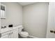 Cozy bathroom features neutral color scheme, single vanity, and shower with curtain at 208 Hembree Park Ter, Roswell, GA 30076