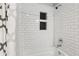 Bathroom features subway tile shower with built-in niche for added functionality and modern design at 208 Hembree Park Ter, Roswell, GA 30076