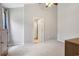 Neutral bedroom with vaulted ceiling, a door to the bathroom and simple modern furniture at 208 Hembree Park Ter, Roswell, GA 30076