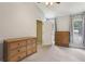 Neutral bedroom with vaulted ceiling and carpet, and modern furniture at 208 Hembree Park Ter, Roswell, GA 30076