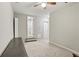 Neutral bedroom offers flexible space for furniture arrangement and personalization with a ceiling fan at 208 Hembree Park Ter, Roswell, GA 30076