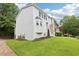 A view of the white-painted brick facade featuring black shutters, bay window and a charming front entrance at 208 Hembree Park Ter, Roswell, GA 30076