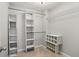 Walk-in closet provides ample storage with built-in shelving and organizational options at 208 Hembree Park Ter, Roswell, GA 30076