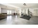 Spacious basement with work out area, neutral walls, and stairwell to upper level at 2689 Spring Rock Ne Ct, Roswell, GA 30075