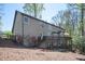 Exterior of home with multi-tiered deck overlooking a wooded backyard at 2689 Spring Rock Ne Ct, Roswell, GA 30075