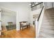 Bright foyer featuring hardwood floors, staircase, and a bench at 2689 Spring Rock Ne Ct, Roswell, GA 30075