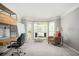 Bright living room with large windows, a modern desk, and an accent chair at 2689 Spring Rock Ne Ct, Roswell, GA 30075